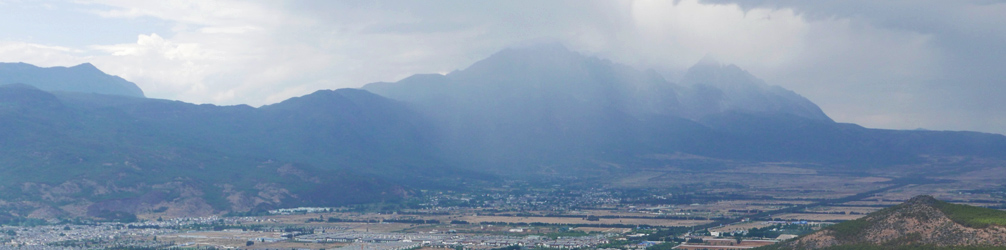 Yulong Mountain on a bad day.  Overcast and lots of clouds hovering around the peak